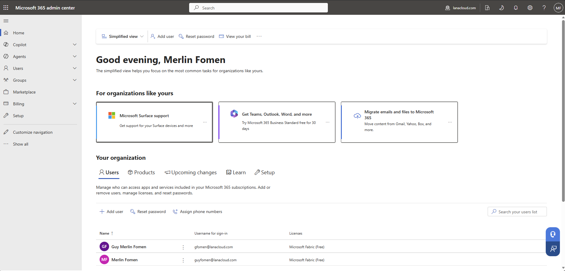 Microsoft 365 Admin Center — two users: Guy Merlin Fomen (gfomen@lanacloud.com) and Merlin Fomen (guyfomen@lanacloud.com), both with Microsoft Fabric (Free) licence